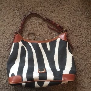 Dooney and Burke faux leather animal print purse.